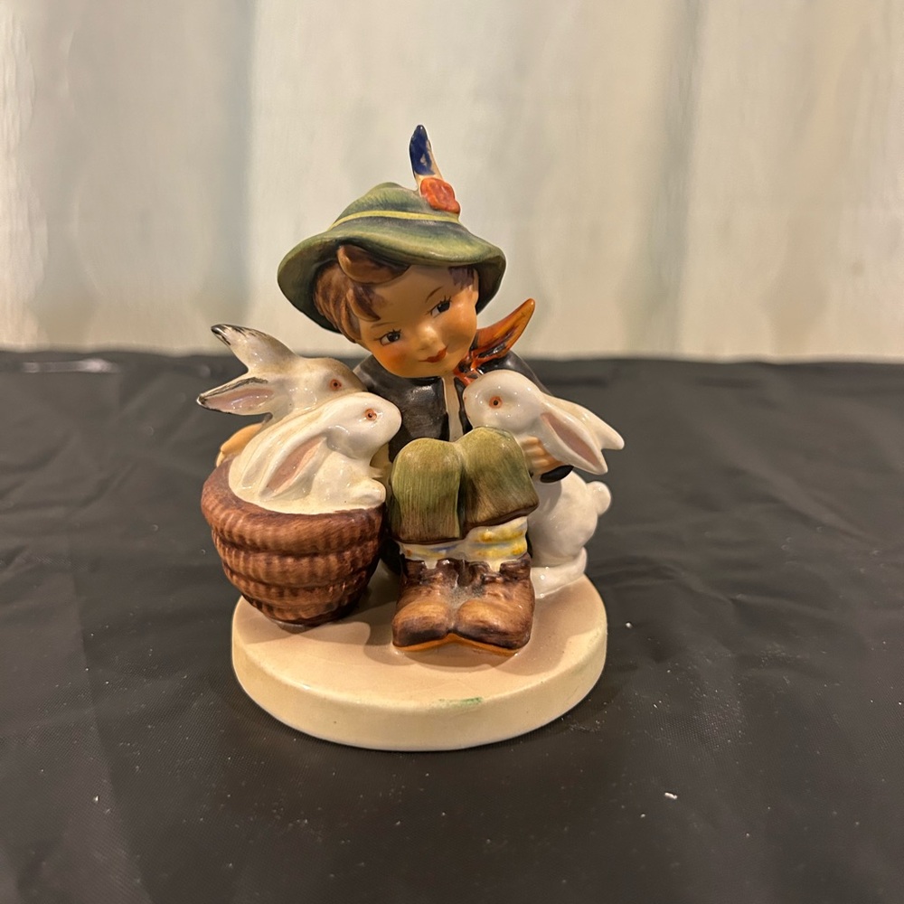 Hummel Figurine with Green Hat and White Rabbits